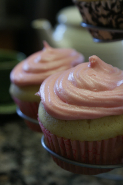 vanilla cupcakes with pink buttercream-cream cheese frosting
